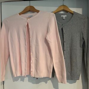 Pink, gray, and white cardigans